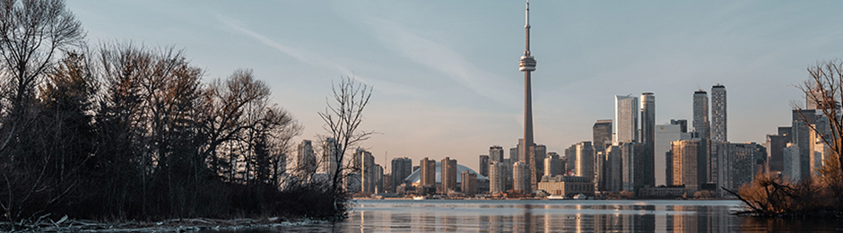 Landscape of CN Tower and downtown Toronto skyline taken from the eastern shoreline of Lake Ontario.
